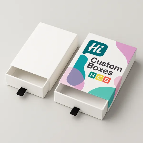 Sleeve and tray chocolate boxes with ribbon pulls - one plain white- one printed with abstract pastel shapes and Hi Custom Boxes logo- class=